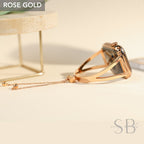 Rose gold Apple Watch band with a chain detail. The band is made of metal and has a sleek, modern design.