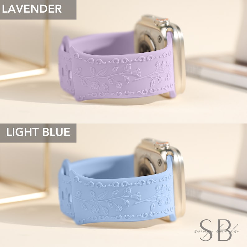 Two Apple Watch bands with a floral design. The band on top is lavender and the band on the bottom is light blue.