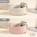 Two Apple Watch bands with a floral design. The band on top is white with a white floral design. The band on the bottom is pink with a pink floral design. The text "STARLIGHT" is above the white band and the text "PINK" is above the pink band.