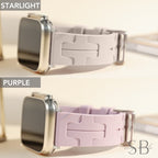 Two Apple Watch bands in different colors. The top band is a light gray color and the bottom band is a light purple color. Both bands have a textured design and are made of silicone.