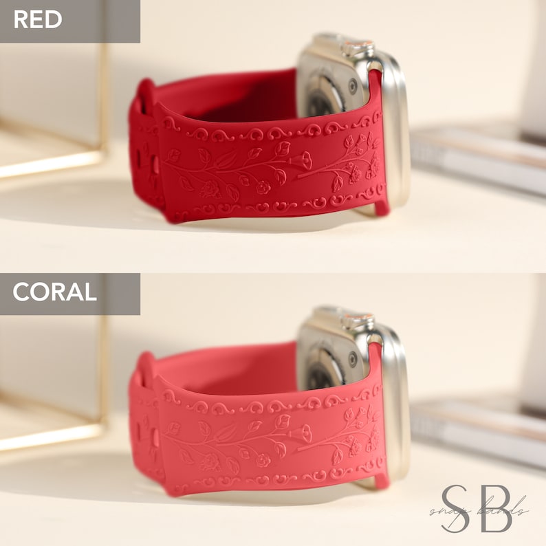 A red and coral silicone Apple Watch band with a floral design. The band is shown on a silver Apple Watch.